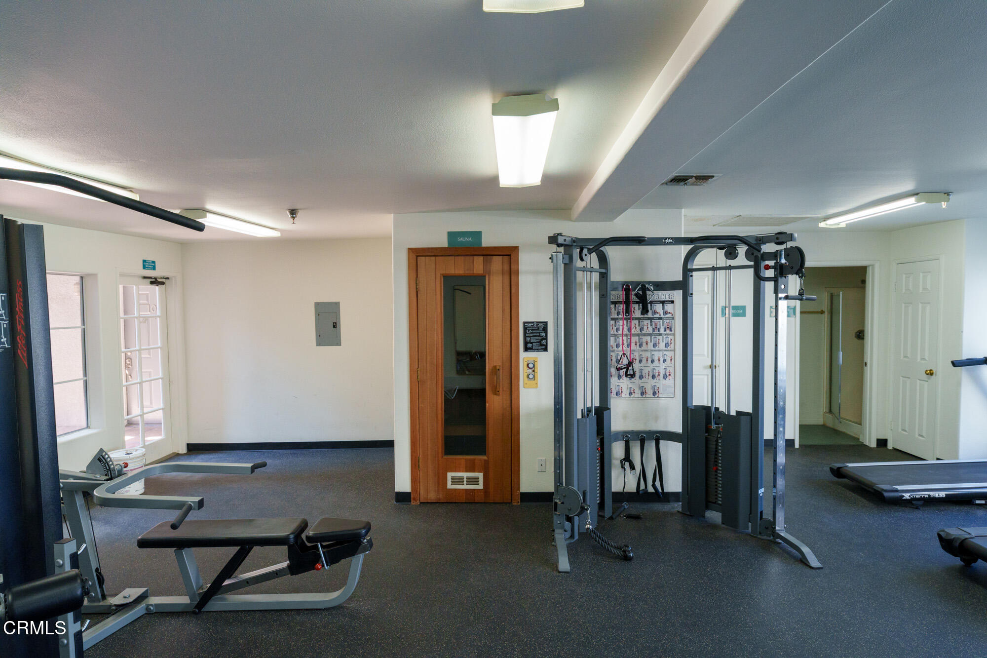 10925 Blix Street, Unit 102 Toluca Lake, CA 91602 - Photo 22 of 29 a view of a room with gym equipment