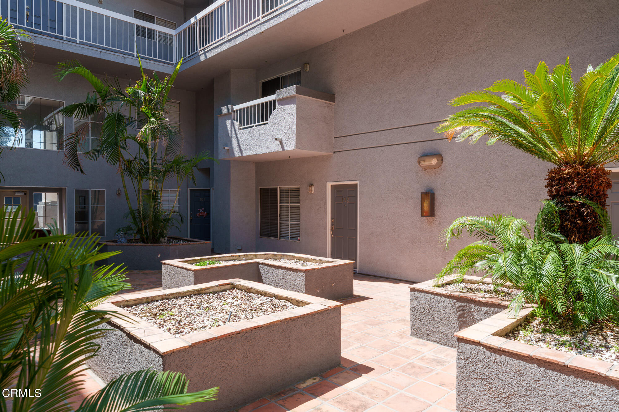 10925 Blix Street, Unit 102 Toluca Lake, CA 91602 - Photo 25 of 29 a view of a dinning table and chair in the patio