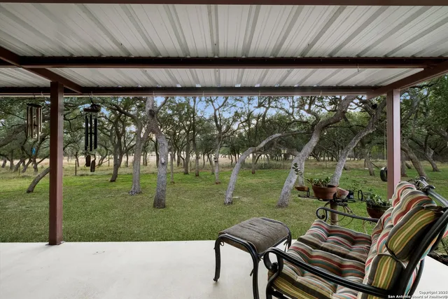 a view of yard with furniture and garden