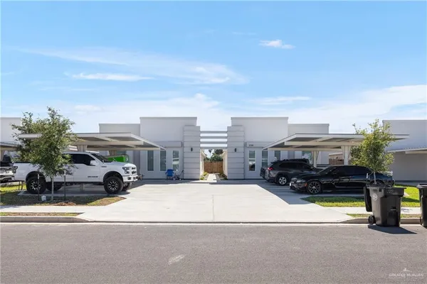 a view of multiple houses with yard