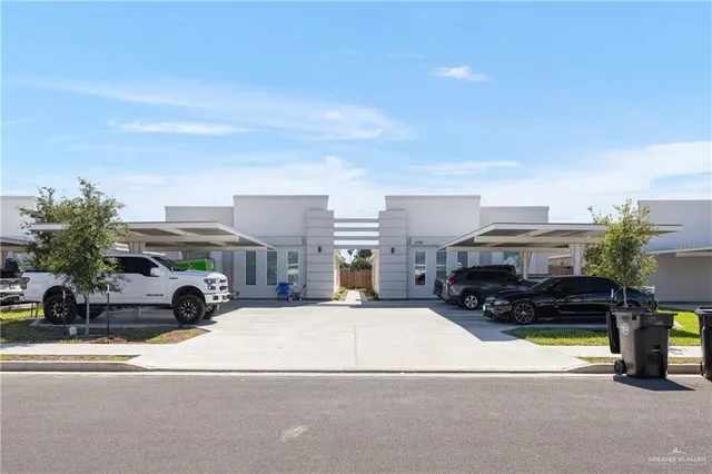 a view of multiple houses with yard