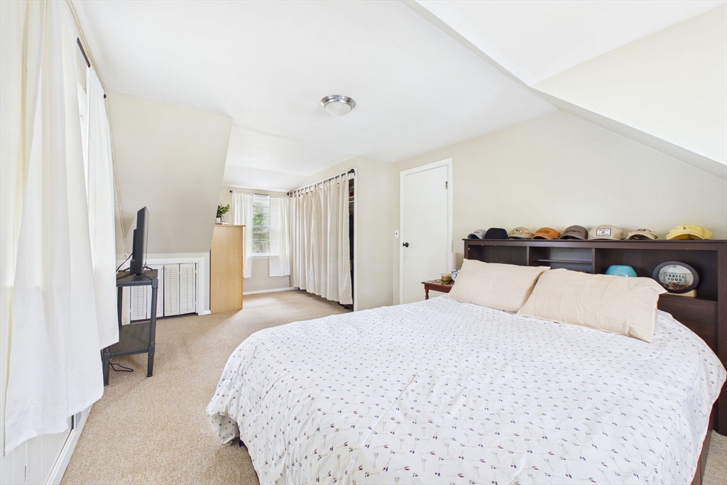 13 Albatross Avenue Wareham, MA 02538 - Photo 21 of 25 a bedroom with a bed and a large mirror