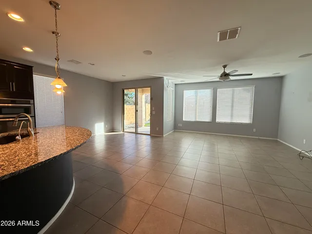 a view of a kitchen with a sink and a window