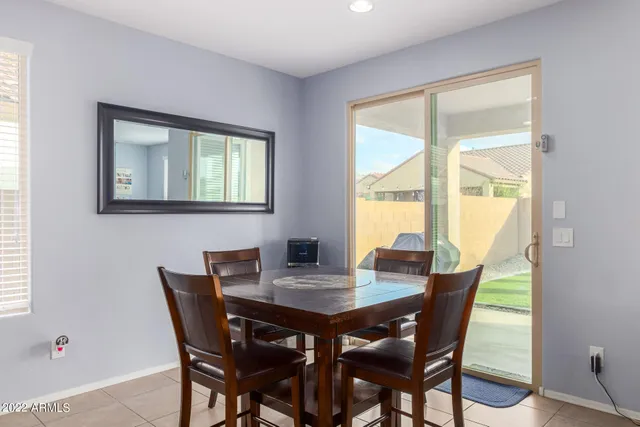 a view of a dining room with furniture and window