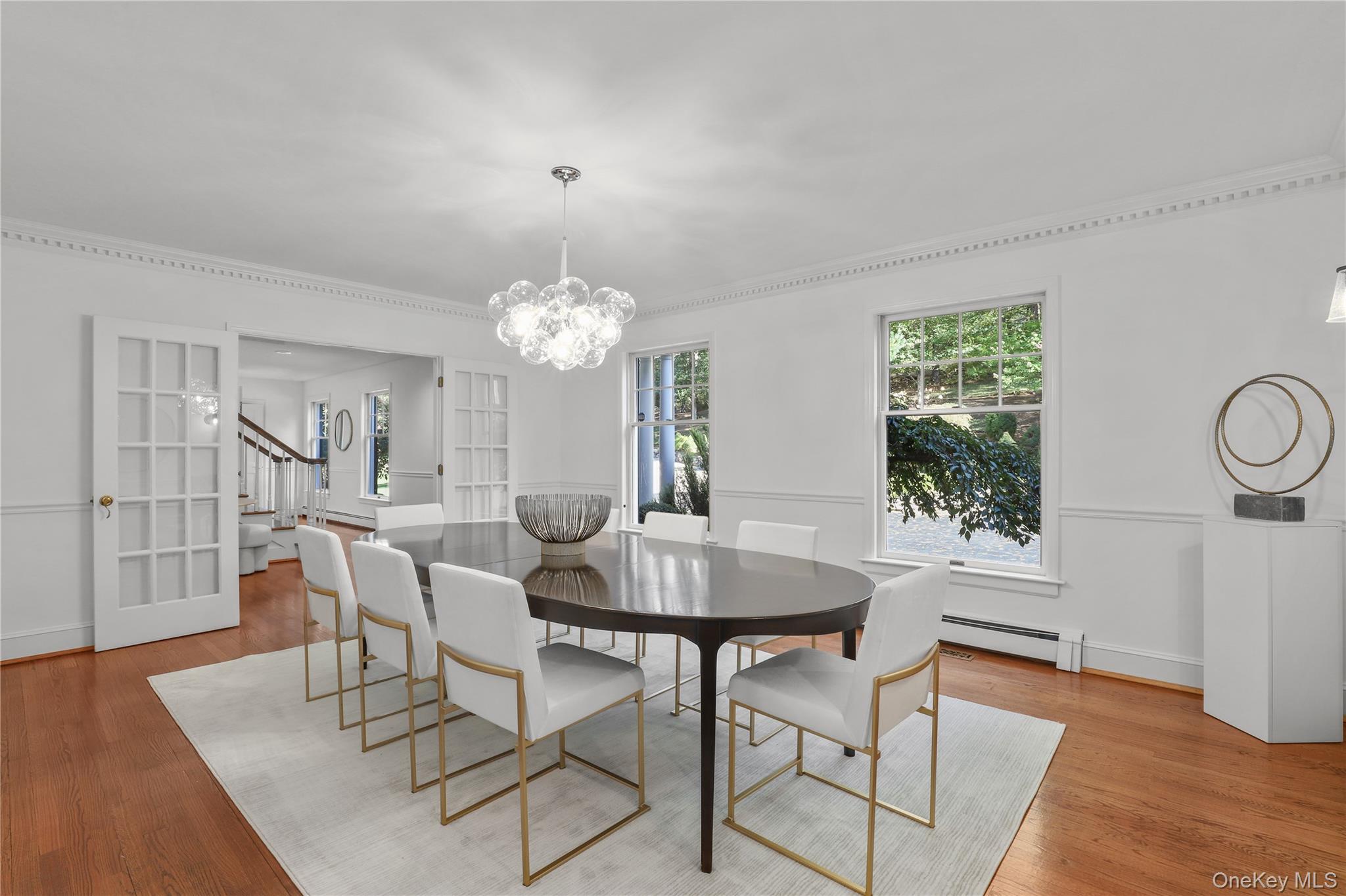 30 Knapp Road Pound Ridge, NY 10576 - Photo 12 of 38 a dining room with furniture a chandelier and wooden floor