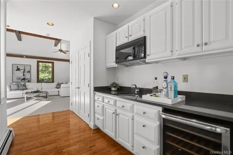a kitchen with stainless steel appliances white cabinets and sink