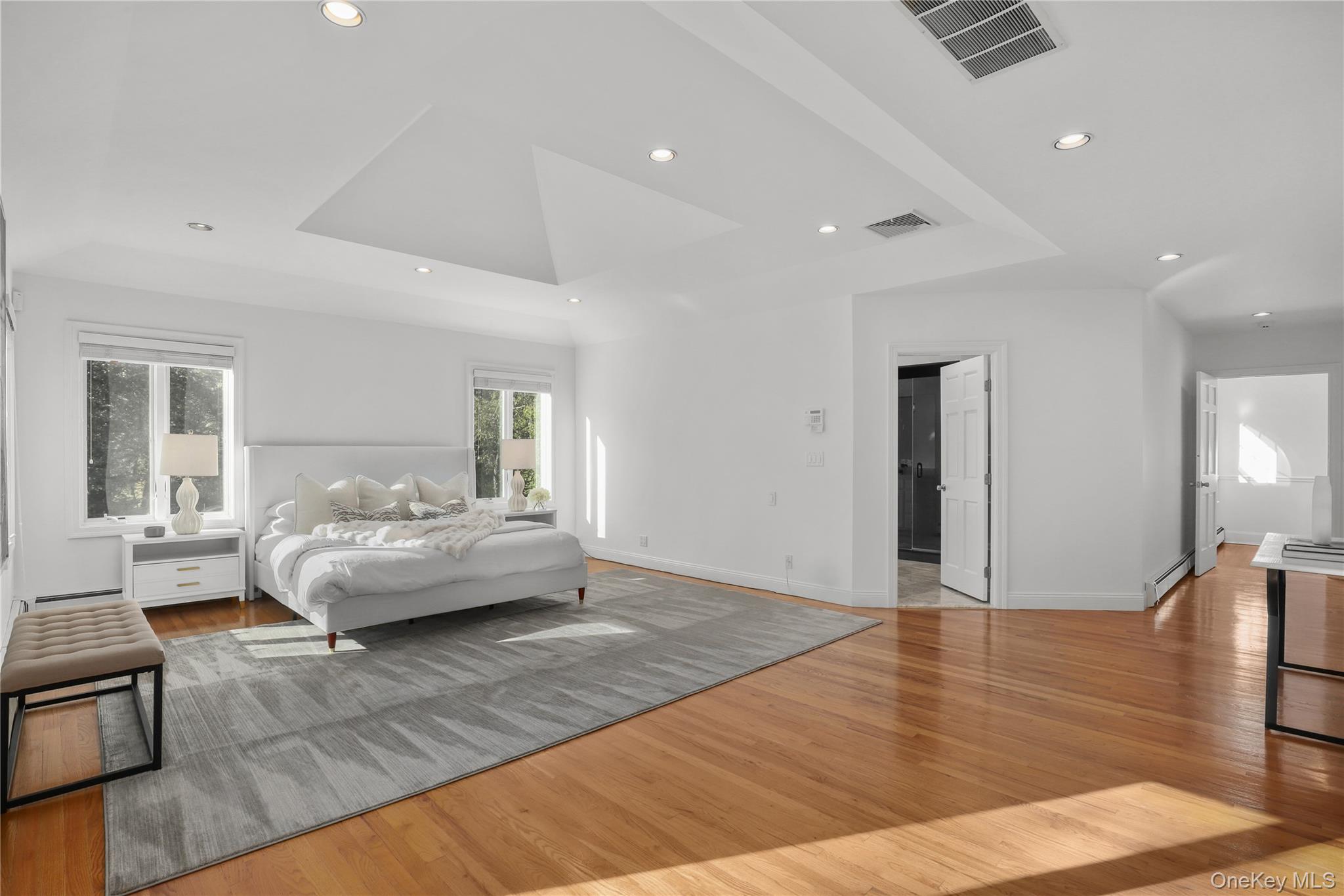 30 Knapp Road Pound Ridge, NY 10576 - Photo 21 of 38 a spacious bedroom with a bed and wooden floor