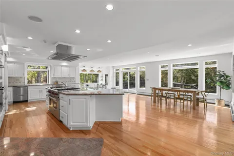 a kitchen with lots of counter top space and stainless steel appliances