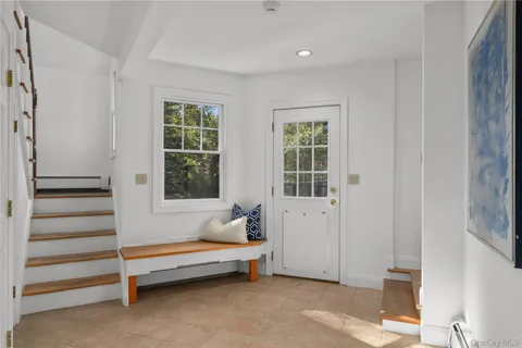 a spacious bedroom with a bed and a window