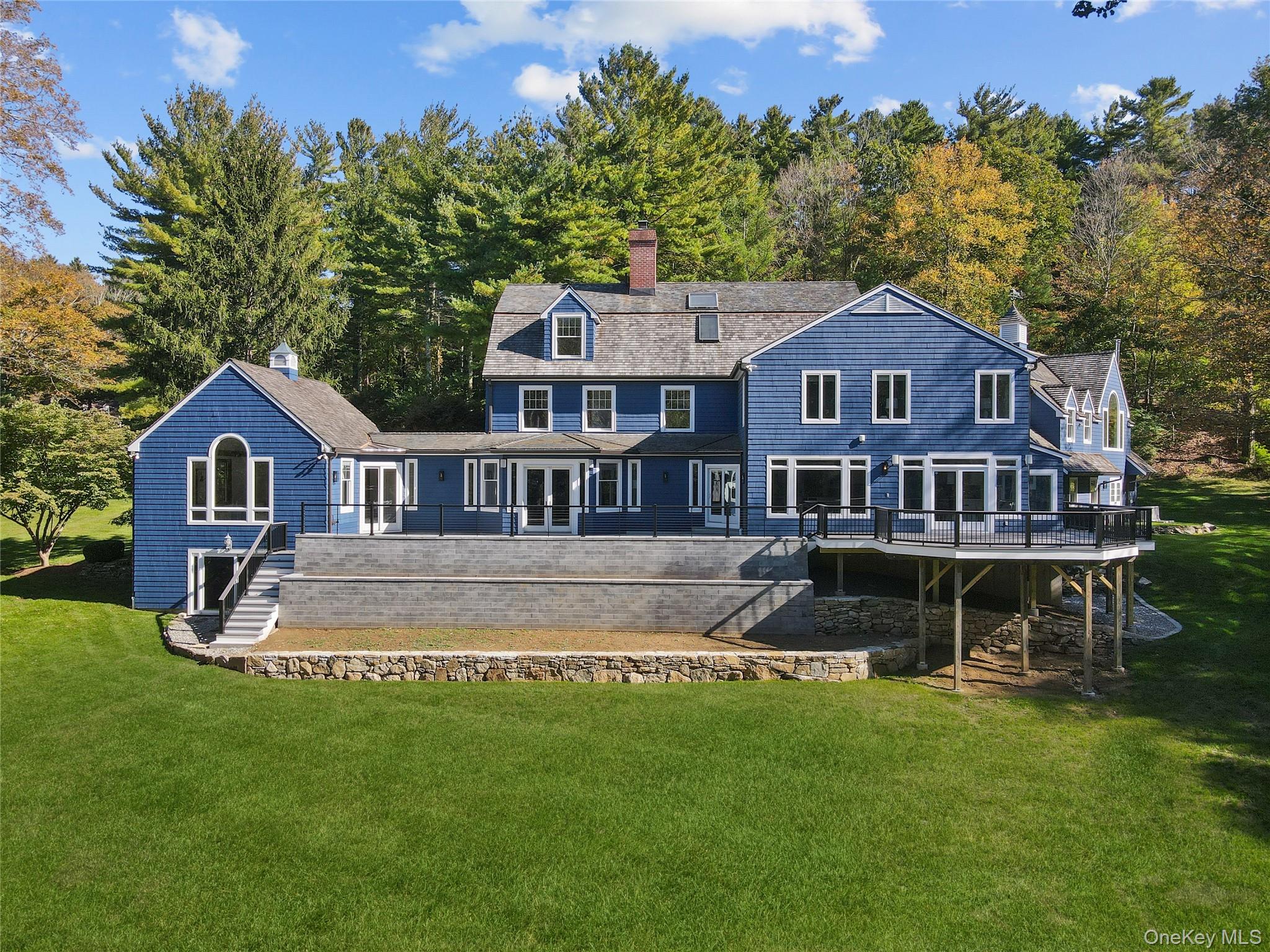 30 Knapp Road Pound Ridge, NY 10576 - Photo 9 of 38 a front view of a house with a yard