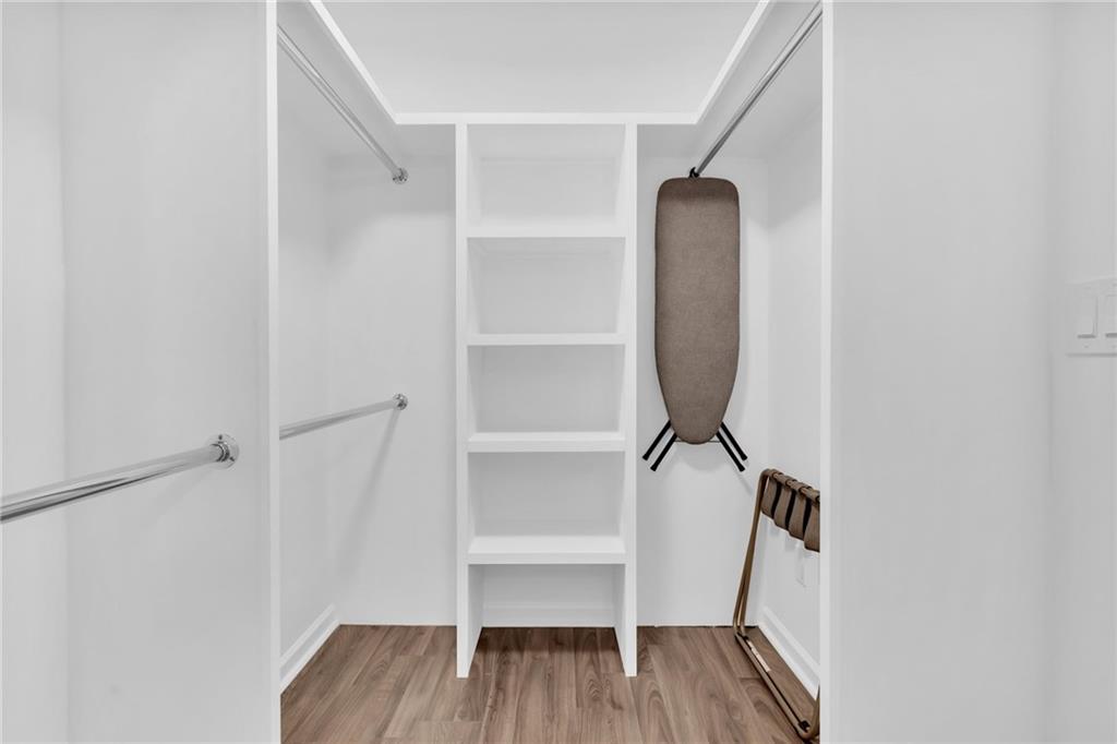 3882 The Ascent Northeast Atlanta, GA 30319 - Photo 20 of 56 a view of a room with wooden floor and white walls