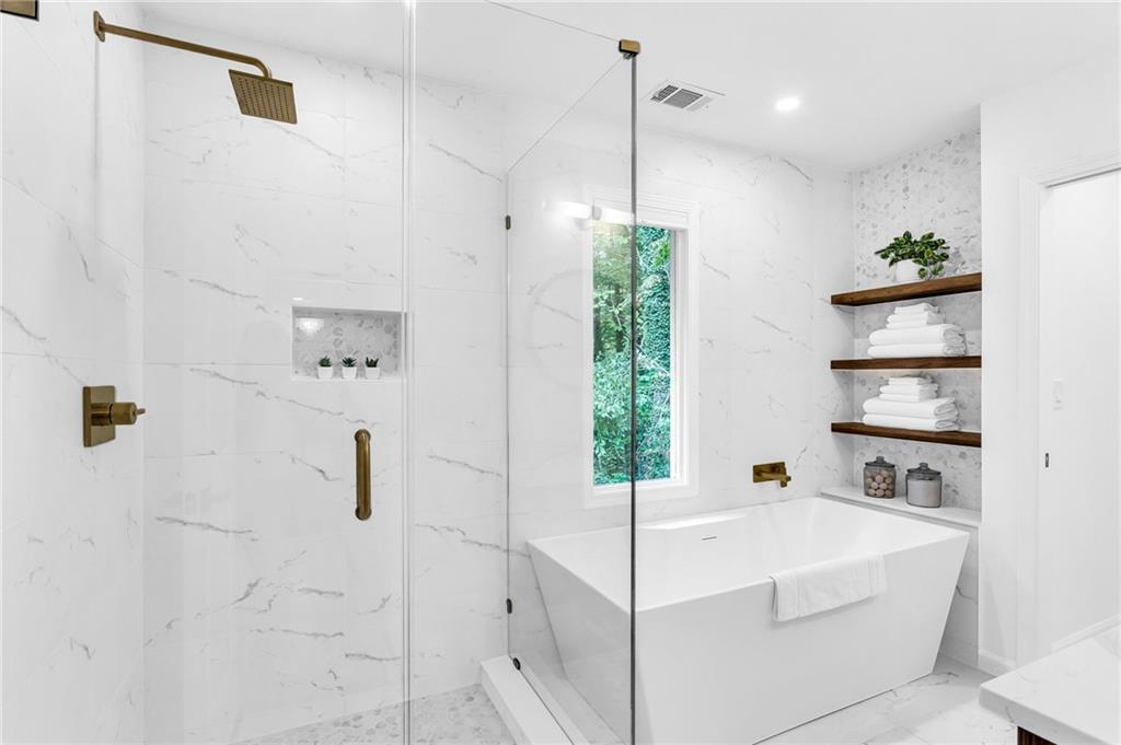 3882 The Ascent Northeast Atlanta, GA 30319 - Photo 22 of 56 a white bath tub sitting in a bathroom