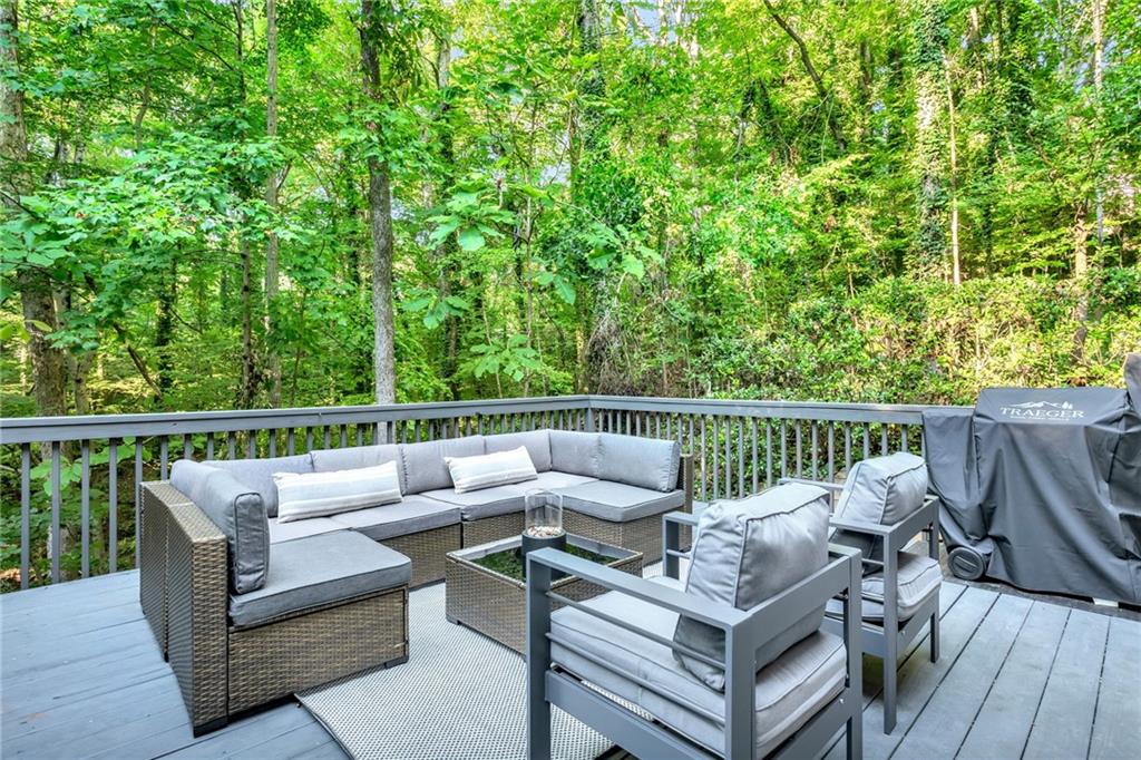 3882 The Ascent Northeast Atlanta, GA 30319 - Photo 51 of 56 a balcony with wooden floor and outdoor seating