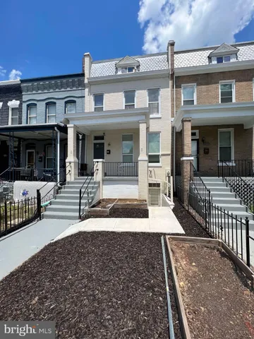 a front view of a house with a porch
