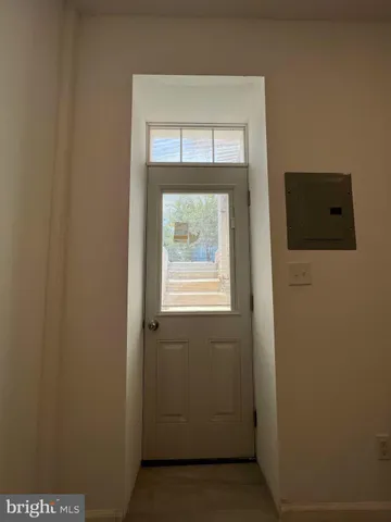 a view of entryway with wooden floor