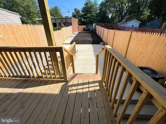 a view of outdoor space with deck and yard