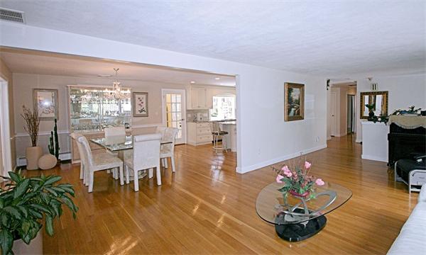 7 Blueberry Hill Road Weston, MA 02493 - Photo 11 of 29 a living room with furniture couches and a dining table with wooden floor
