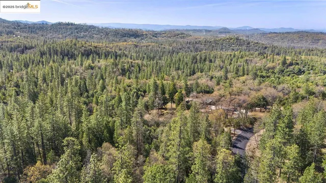 a view of a city with mountains in the background