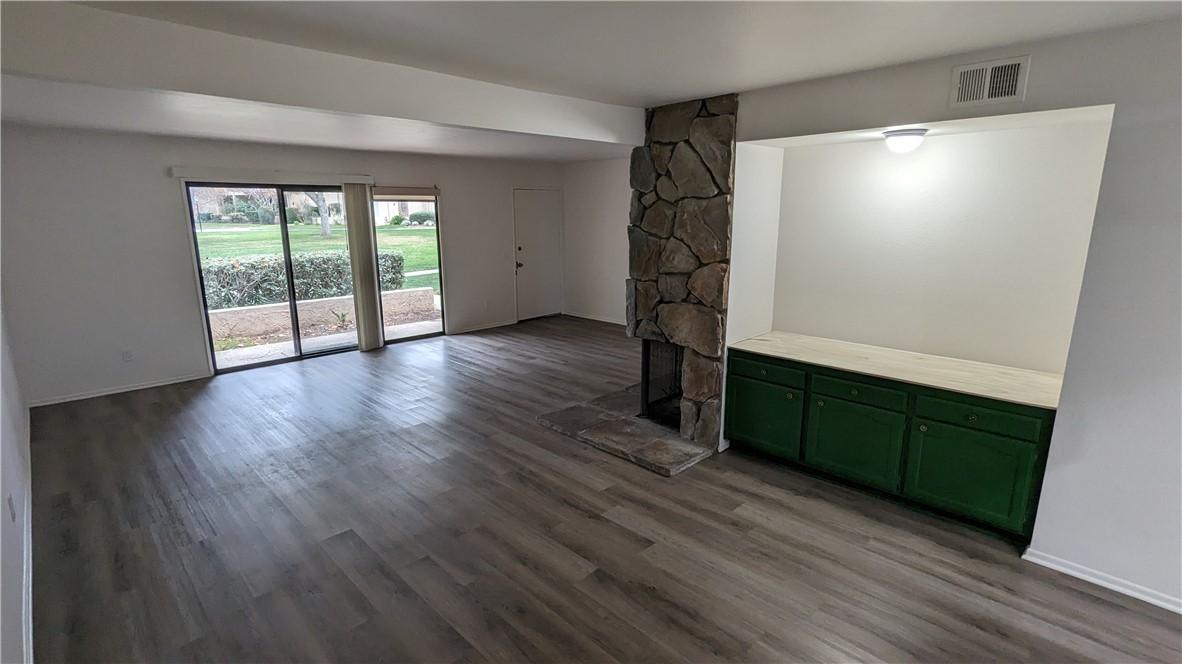 2645 Cortina Drive Riverside, CA 92506 - Photo 3 of 17 a view of an empty room with wooden floor and a window