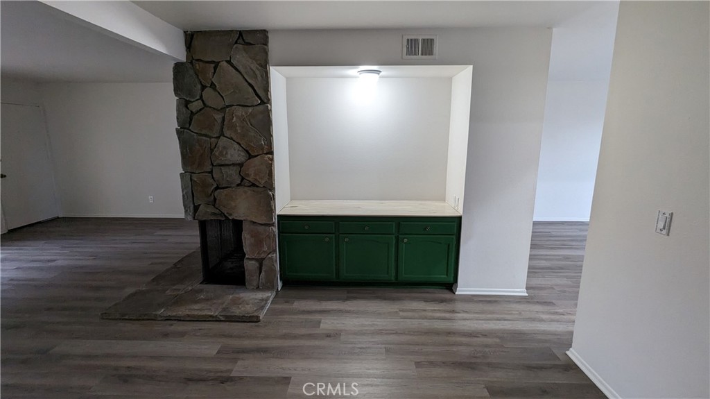 2645 Cortina Drive Riverside, CA 92506 - Photo 4 of 17 a view of empty room with wooden floor and fan