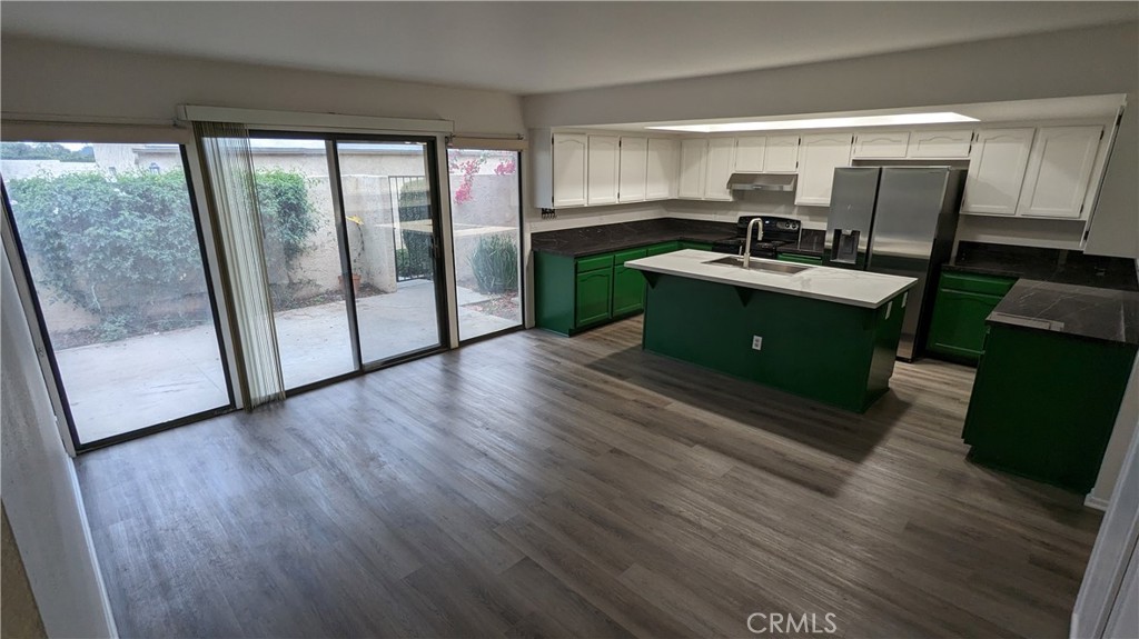 2645 Cortina Drive Riverside, CA 92506 - Photo 5 of 17 a room with furniture and a wooden floor