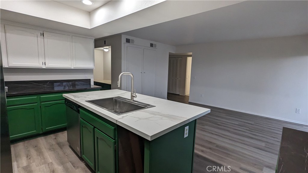 2645 Cortina Drive Riverside, CA 92506 - Photo 7 of 17 a kitchen that has a sink and a stove in it