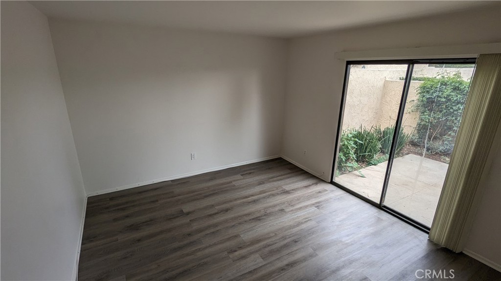 2645 Cortina Drive Riverside, CA 92506 - Photo 10 of 17 a view of empty room with wooden floor and fan