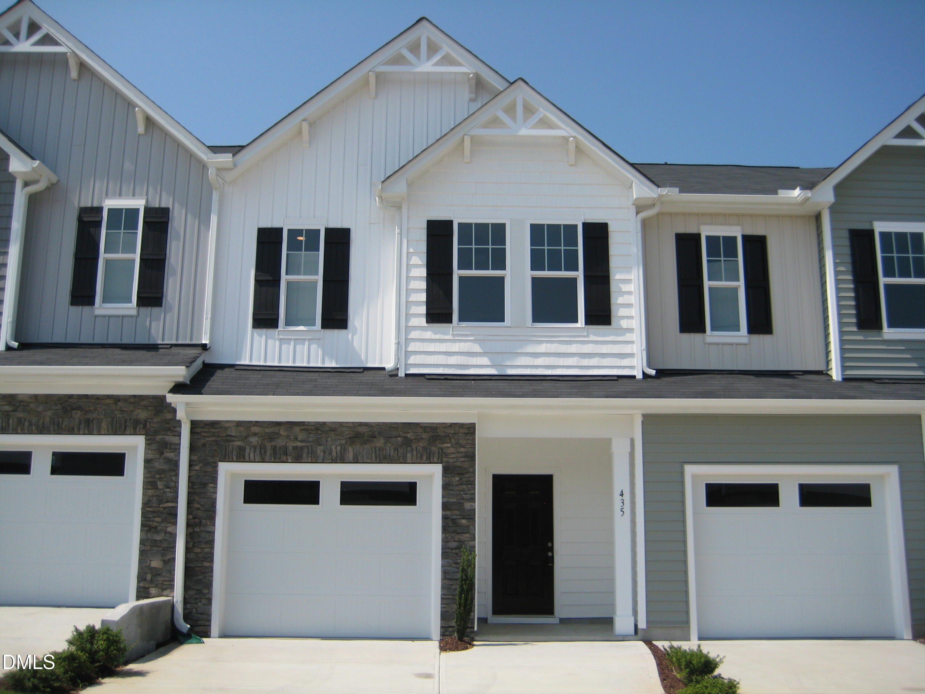 a front view of a house with a garage