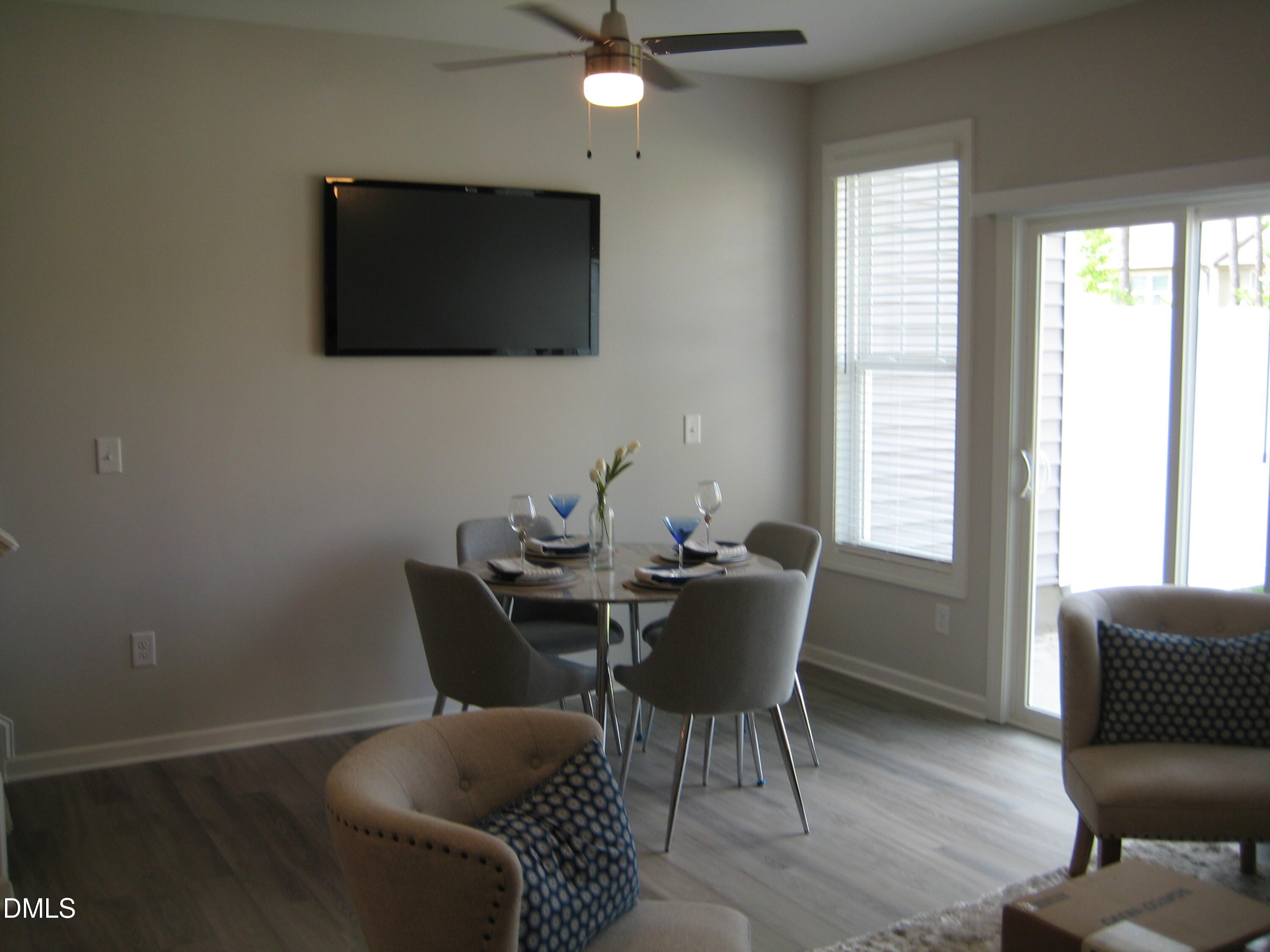 422 Morgan Brook Way Rolesville, NC 27571 - Photo 3 of 6 a work room with furniture a flat screen tv and a window