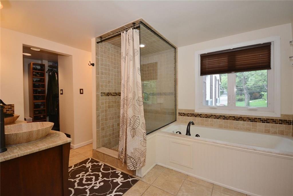 3241 Comanche Road Pittsburgh, PA 15241 - Photo 10 of 25 Maser bathroom with two bowl sinks, shower and separate soaker tub