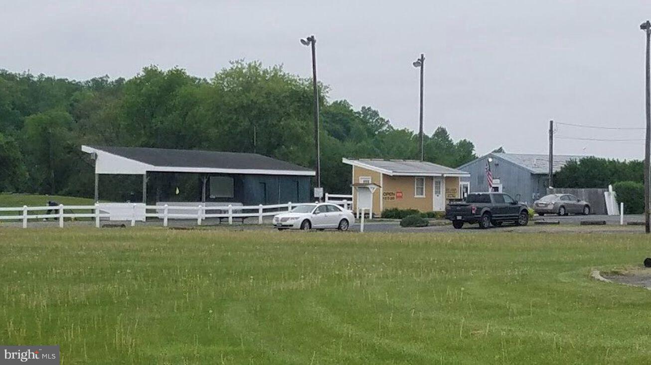 707 Highway 68 Columbus, NJ 08022 - Photo 2 of 4 a view of a house with swimming pool and furniture