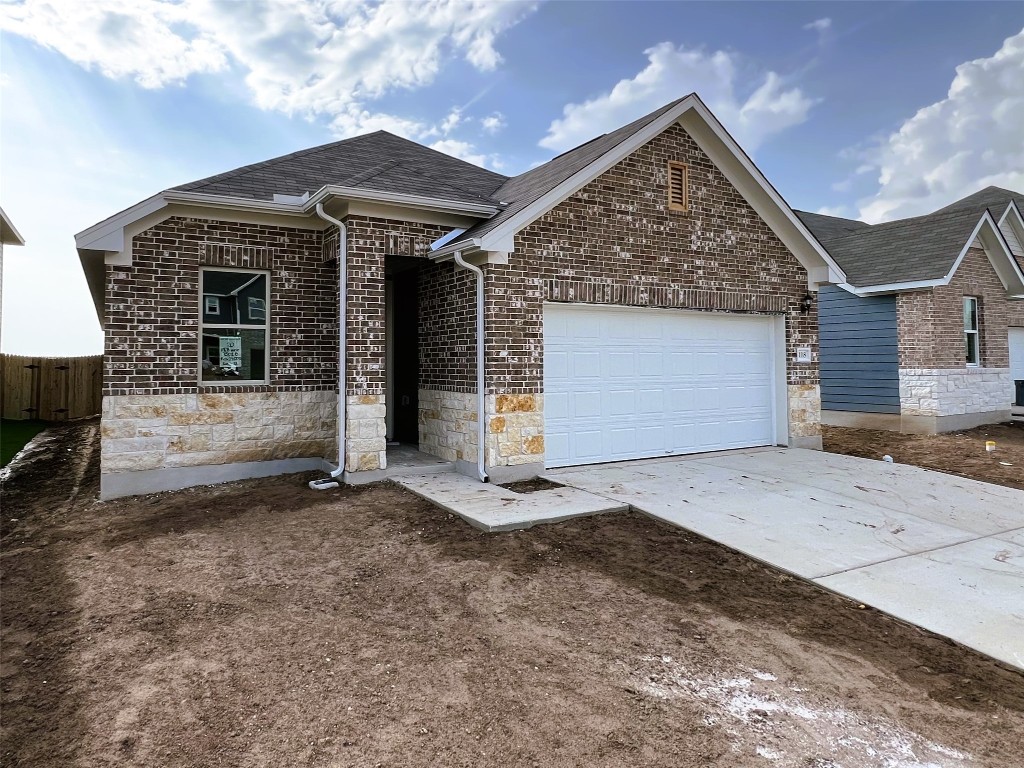 118 Prairie Falls Drive Hutto, TX 78634 - Photo 1 of 1 a front view of a house with a garage