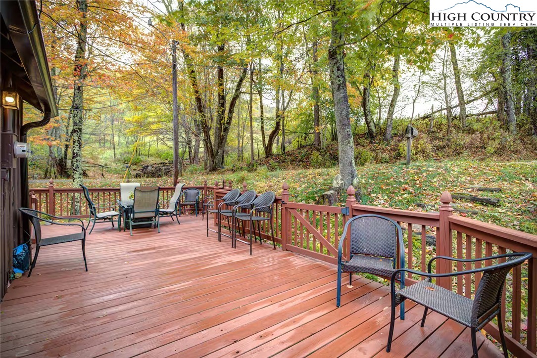 17 Grey Fox Ridge Road Banner Elk, NC 28604 - Photo 19 of 37 a view of a chairs and table on the wooden floor