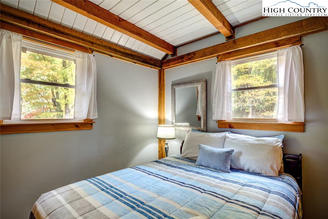 17 Grey Fox Ridge Road Banner Elk, NC 28604 - Photo 23 of 37 a bedroom with a bed and a window