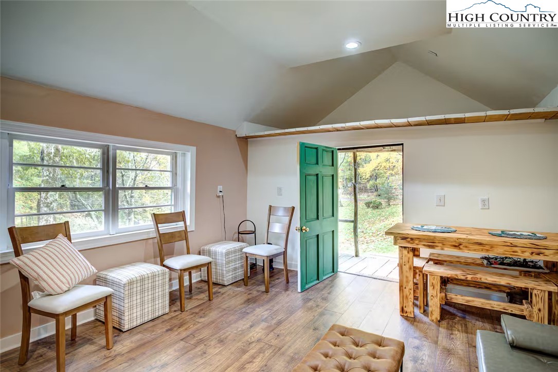 17 Grey Fox Ridge Road Banner Elk, NC 28604 - Photo 32 of 37 a living room with furniture and a floor to ceiling window