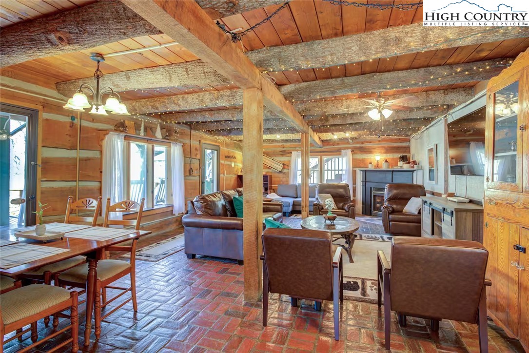 17 Grey Fox Ridge Road Banner Elk, NC 28604 - Photo 4 of 37 a view of a dining room with furniture window and wooden floor