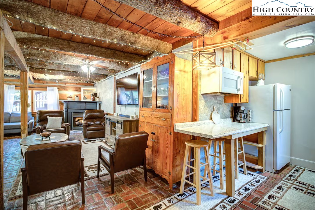 17 Grey Fox Ridge Road Banner Elk, NC 28604 - Photo 5 of 37 a view of a dining room with furniture window and wooden floor