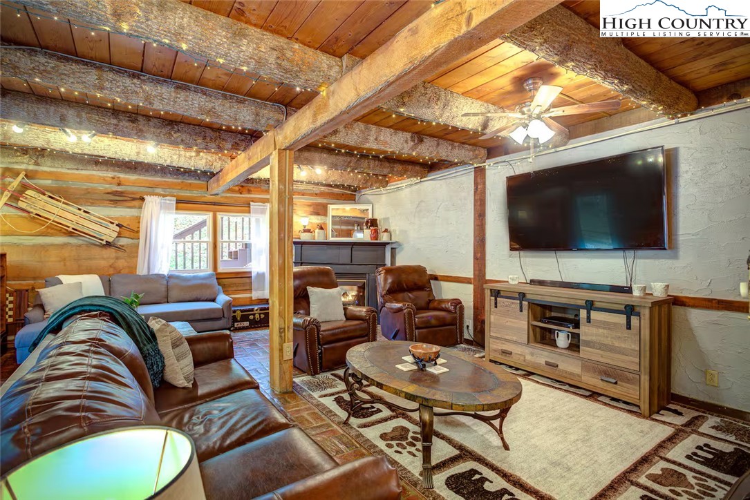 17 Grey Fox Ridge Road Banner Elk, NC 28604 - Photo 6 of 37 a living room with furniture and a flat screen tv