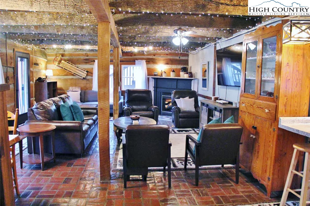 17 Grey Fox Ridge Road Banner Elk, NC 28604 - Photo 7 of 37 a view of a livingroom with furniture and a window