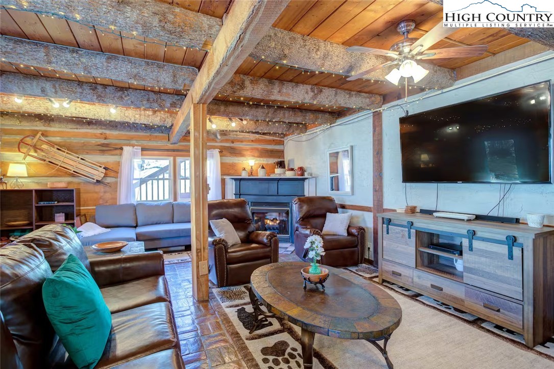 17 Grey Fox Ridge Road Banner Elk, NC 28604 - Photo 8 of 37 a living room with furniture and a flat screen tv