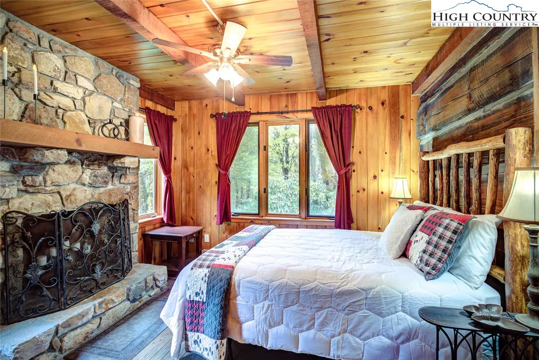 17 Grey Fox Ridge Road Banner Elk, NC 28604 - Photo 9 of 37 a bed sitting in a bedroom next to a window