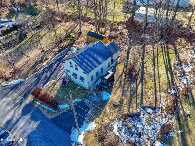 a view of a backyard with a deck and wooden floor