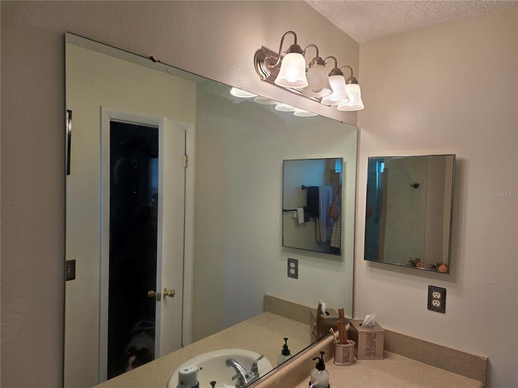Undisclosed Address Ocala, FL 34472 - Photo 17 of 21 a bathroom with a tub and a mirror