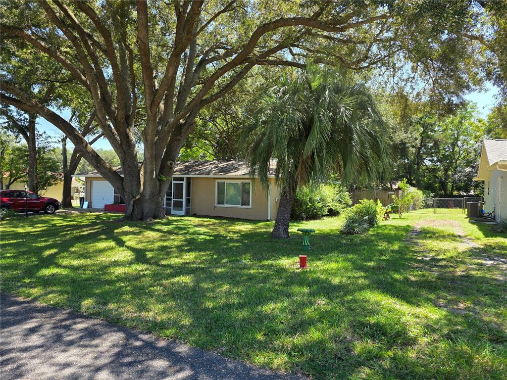 Undisclosed Address Ocala, FL 34472 - Photo 4 of 21 a view of a house with a backyard