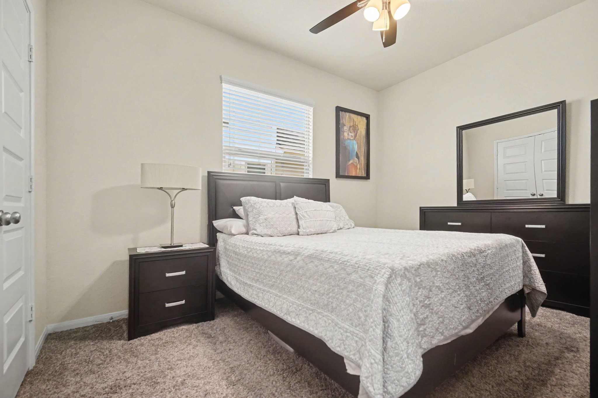 14219 Rim Side Trail Houston, TX 77045 - Photo 12 of 21 The secondary bedroom is very spacious with large window and ceiling fan!