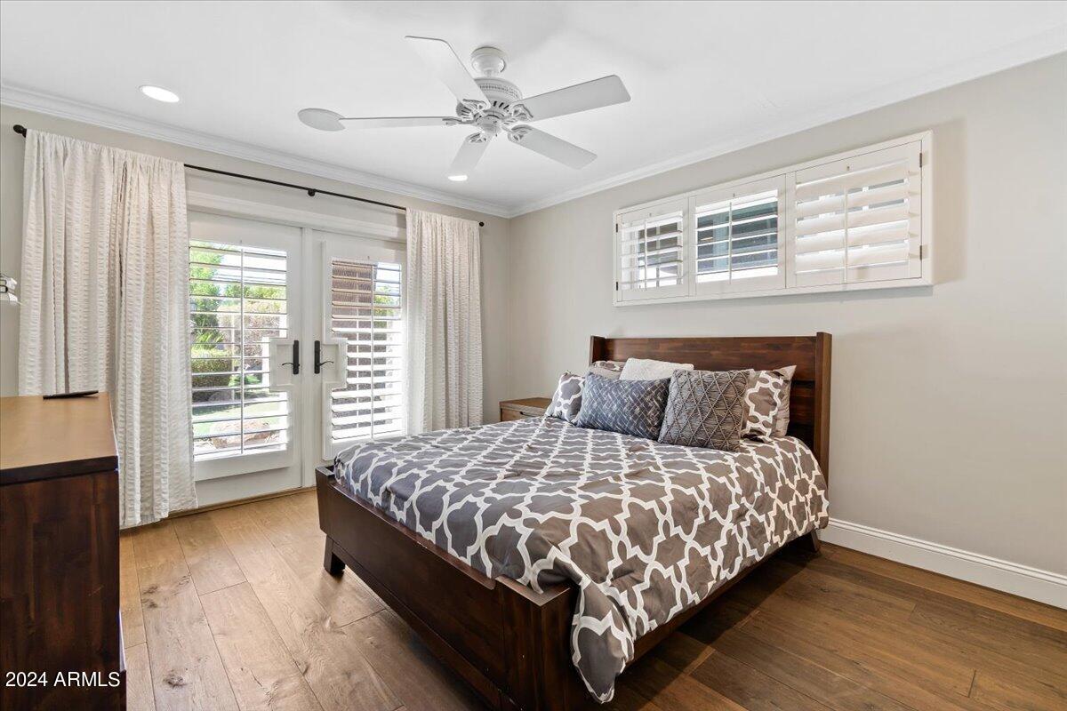 3841 East Elm Street Phoenix, AZ 85018 - Photo 41 of 72 a bedroom with a large bed and a tv