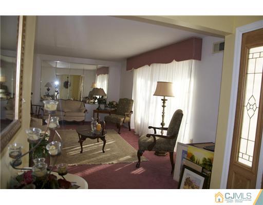 521 New Brunswick Road Somerset, NJ 08873 - Photo 2 of 11 a living room with furniture and a large window