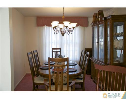 521 New Brunswick Road Somerset, NJ 08873 - Photo 4 of 11 a view of a dining room with furniture and window