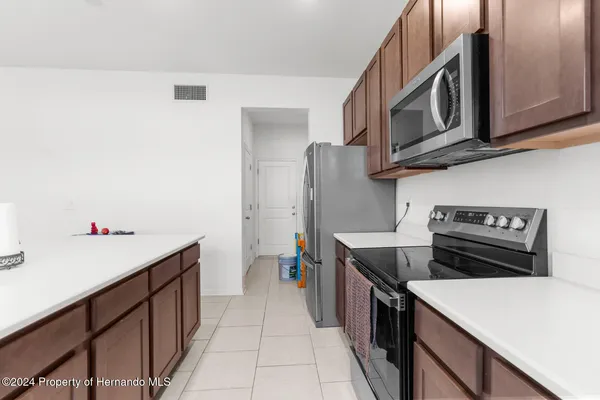 a kitchen with a stove and a microwave