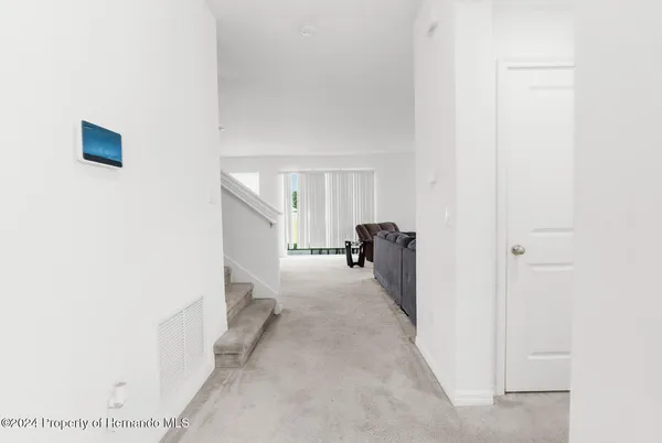 a view of a room with a hallway